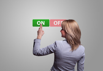 woman hand pressing ON button