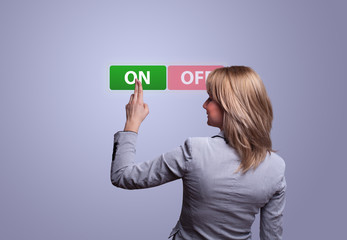 woman hand pressing ON button