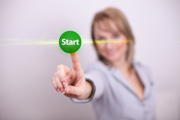 Woman pressing start button