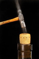 Hammer the wine cork in.