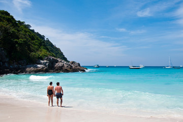 man and woman on the beach