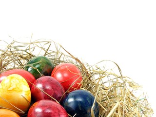 A selection of shiny easter eggs on a grass background