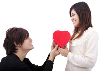 Fototapeta na wymiar Asian young Man handing over love gift to young woman