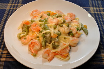 Shrimp with Creamy Garlic Sauce Served on a White Plate