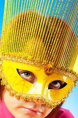 Attractive woman posing in the stylish mask