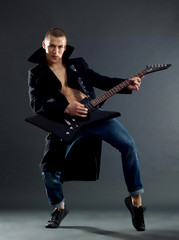 Fototapeta premium passionate guitarist playing his electric guitar