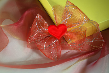 Gift with heart and ribbon