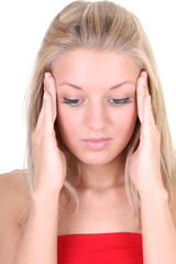 woman with headache holding her head with hands