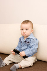 Cute caucasian boy with tv console
