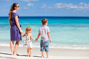 Mother and two kids at beach