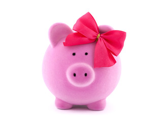 Pink piggy bank with red bow