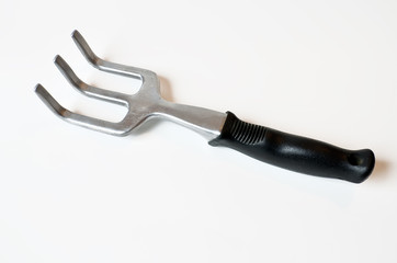 Hand sized garden fork isolated on white background