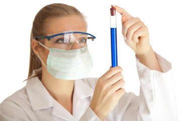 Isolated scientist woman in lab coat with chemical glassware