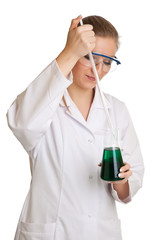 Isolated scientist woman in lab coat with chemical glassware