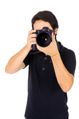Young male photograher at studio, isolated on white