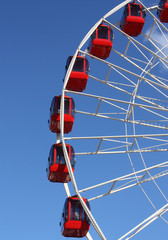 The Red Pods on a Large Fun Fair Big Wheel.