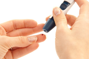 Lancet in hand prick finger for blood glucose level