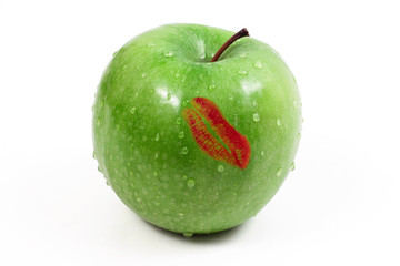 Lipstick on a green apple