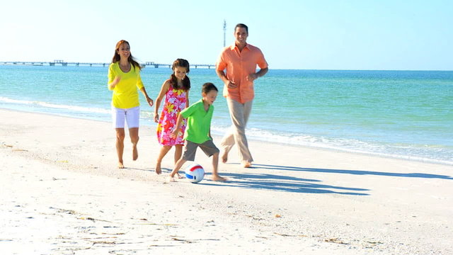 Family Kicking a Ball on the Beach filmed at 60FPS
