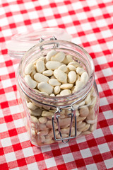 white beans in glass jar