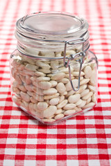 white beans in glass jar