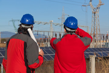 Engineers at Work In a Solar Power Station