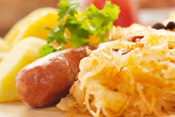 Sausage with potatoes and sauerkraut - obrazy, fototapety, plakaty