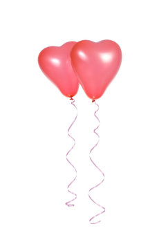 Two red balloons in the shape of a heart