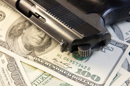 Gun on the dollar-bills