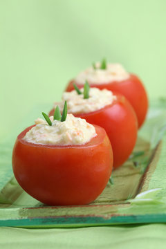 Stuffed tomatoes with cheese, egg and carrot spread