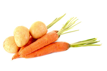 Potatoes and carrots isolated on white