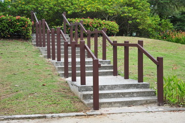 Stair Step In The Park With Wooden Railing