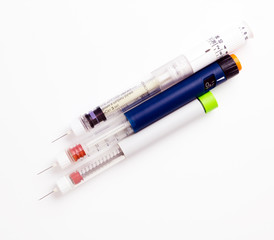 Insulinic syringe-pen, diabetic items on the white paper
