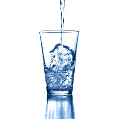 pouring water on a glass