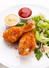 Roasted chicken drumsticks and vegetables