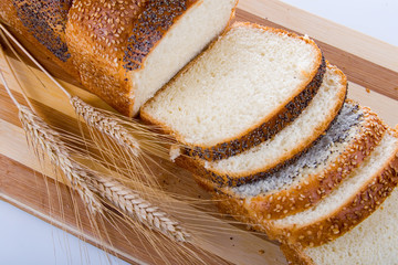 Fresh bread with ears of wheat