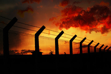 fence under sleeping sunset