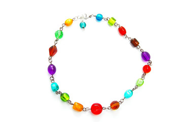 a colorful glass bead necklace on white