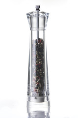 Pepper mills on white background
