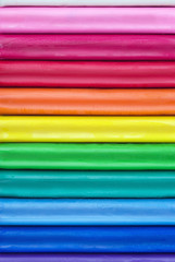 Background of colorful sticks of modelling clay