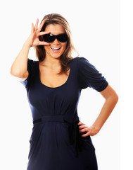 Naklejka premium Young sexy woman and her sunglasses