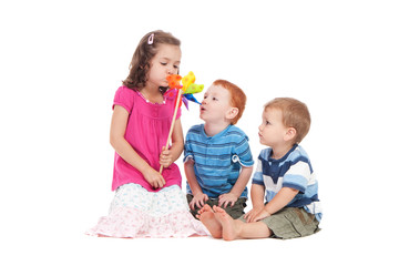 Kids playing with toy windmill