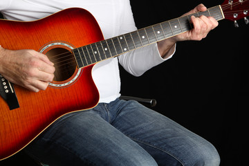 Man Playing a Guitar.