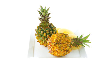 two pineapples on plate