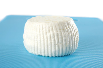 Obraz na płótnie Canvas o-shaped cheese on plate