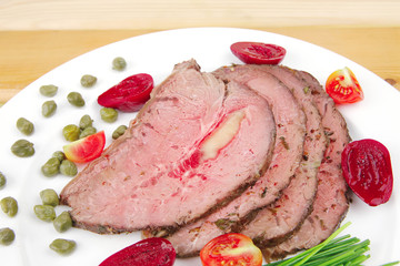 barbecue on white dish over wood