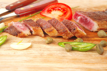 meat steak sliced on wood