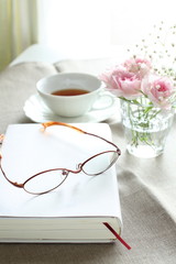 Glasses and book on the table