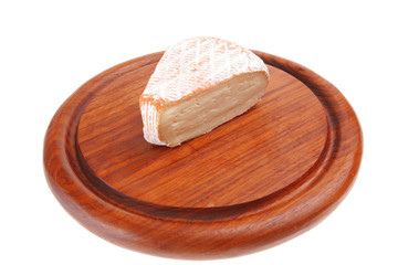 soft cheese served on wood