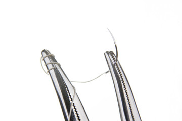 Forceps holding suture